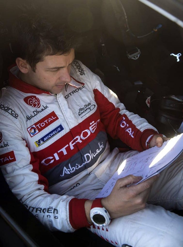 Scott Martin works on Craig Breen's pace notes before a stage in Monte Carlo.